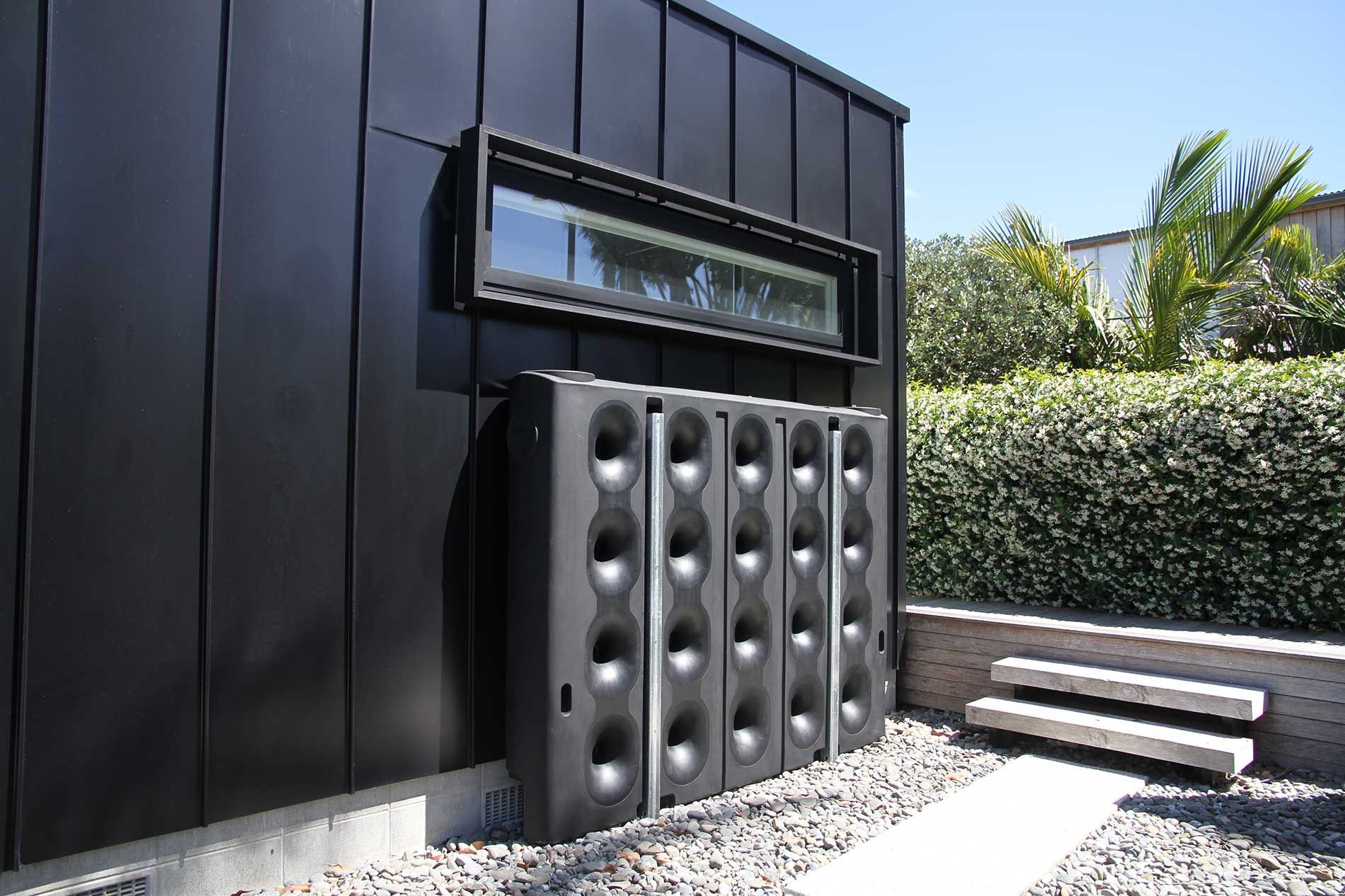 Bailey slimline water tank installed beside a modern home
