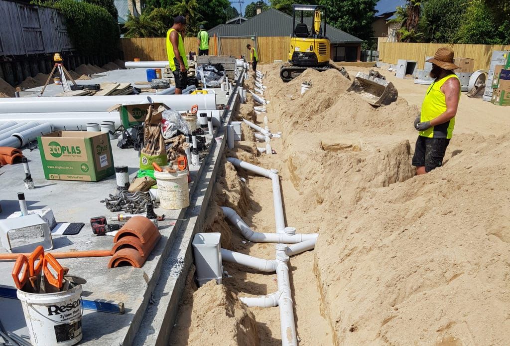 Drainage work underway on a commercial construction site