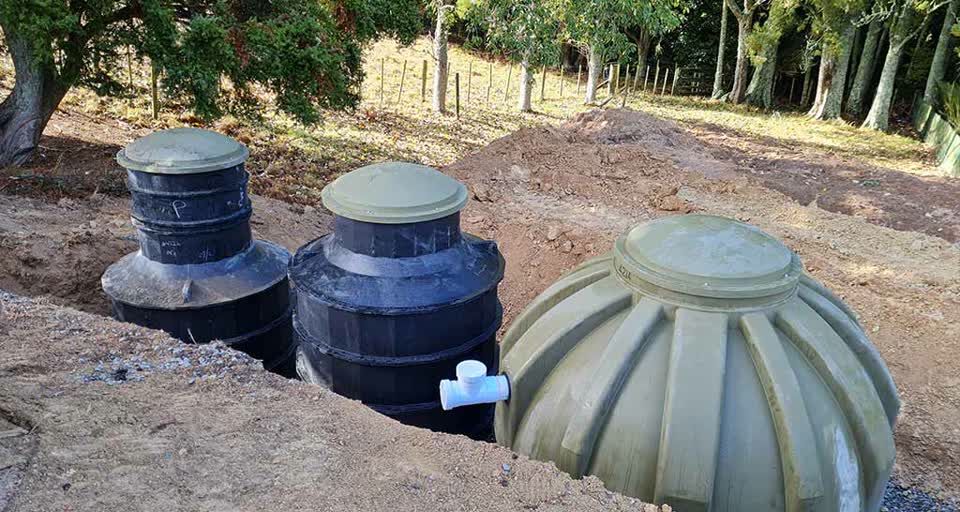 Wastewater treatment tanks being installed below ground